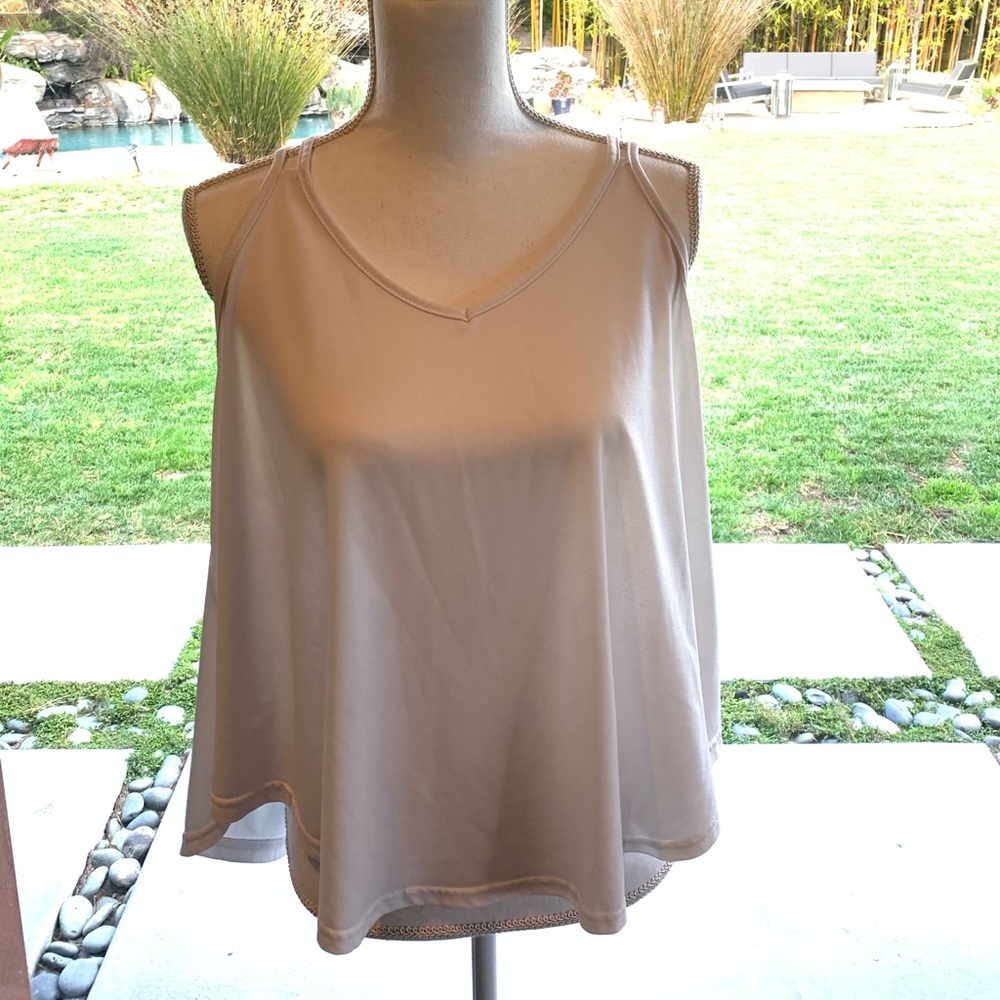 I am selling a beautiful multi strap tank top